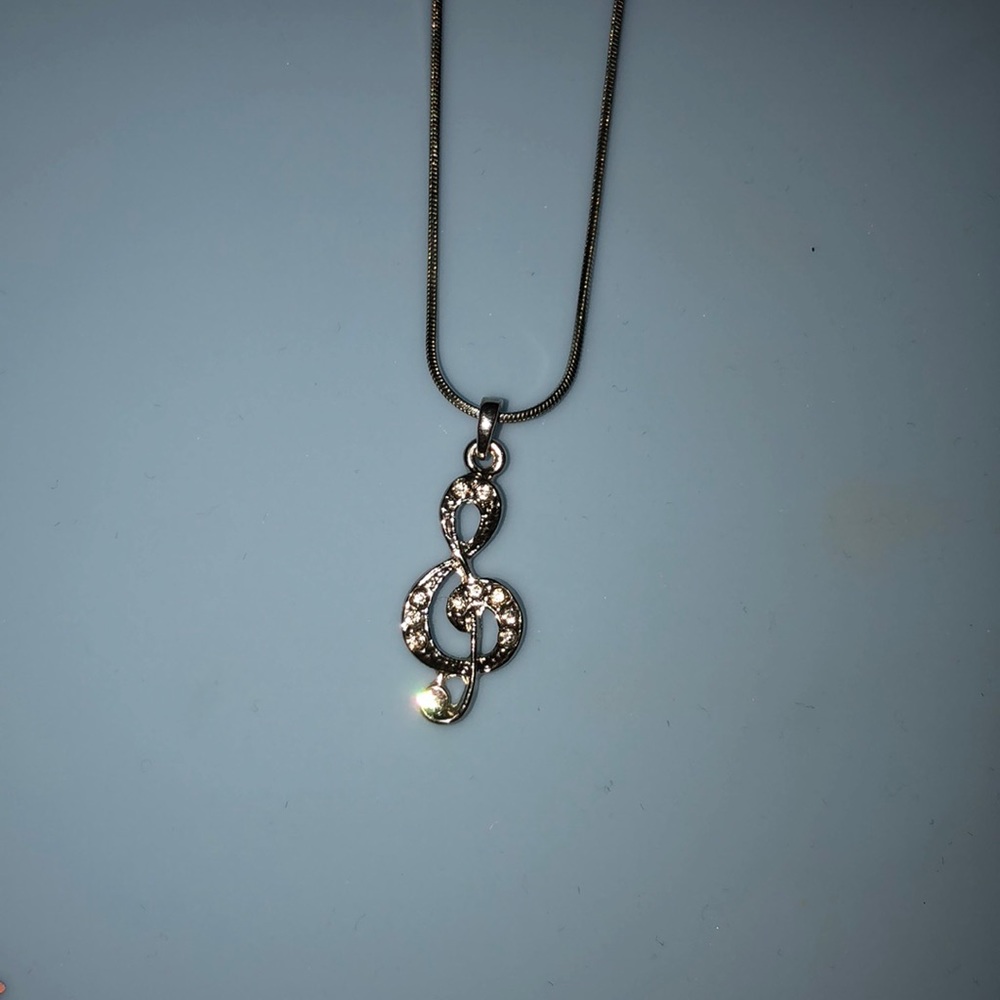 Treble clef necklace